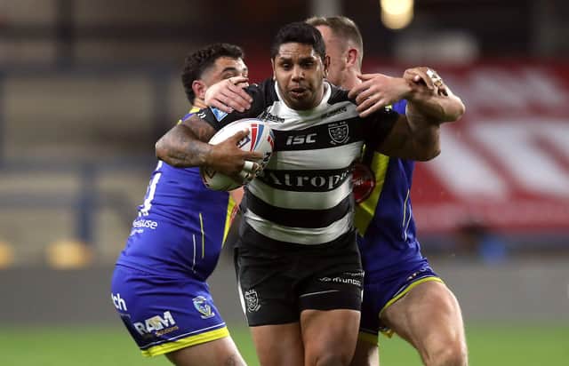 Ploughing on: Hull's Albert Kelly on the ball in the match against Warrington Wolves which went ahead on Friday night but Gareth Ellis can see more games being called off due to Covid - putting the Super League season under real threat. Picture: PA