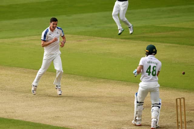 Yorkshire's Matthew Fisher celebrates taking the wicket of Leicestershire's Colin Ackermann.