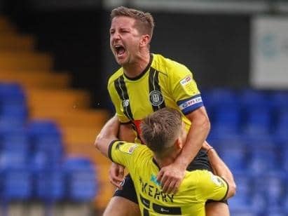 Josh Falkingham celebrates with Lloyd Kerry during Harrogate Town's Carabao Cup victory over Tranmere Rovers. Picture: Matt Kirkham
