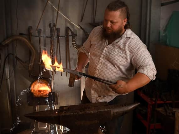 AT THE SHARP END: Jeff Wiggins at the Greenman Forge. Picture: Simon Hulme