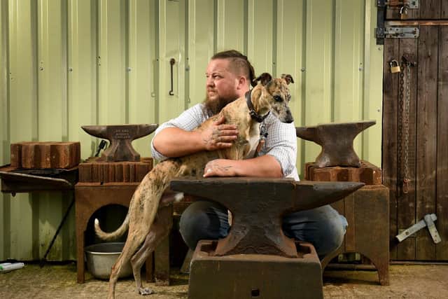ANIMAL MAGIC: Former gamekeeper Jeff taking time out at the forge with his dog Merlin.