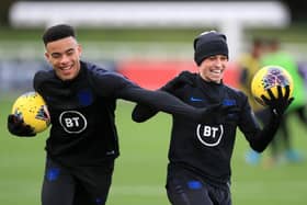 Calm before the storm: Mason Greenwood, left, and Phil Foden enjoy a laugh during England training.