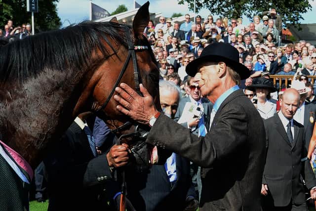 Sir Henry Cecil - by then ailing with cancer - greets Frankel after the horse's victory in the 2012 Juddmonte International at York.