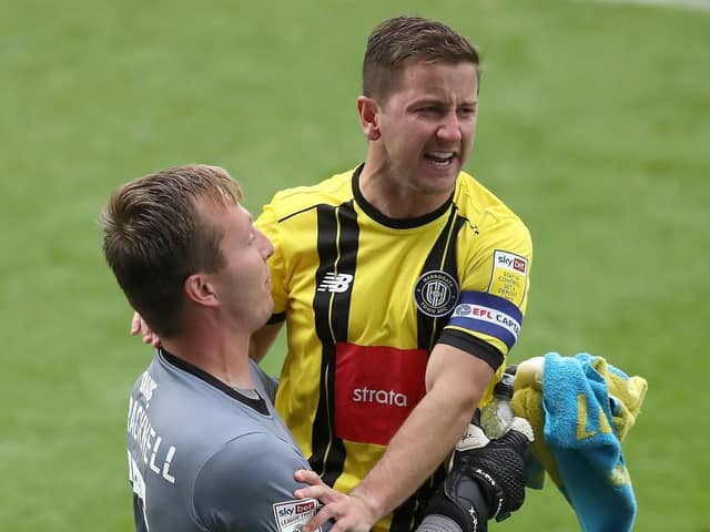VICTORY: Joe Cracknell and Josh Falkingham celebrate Harrogate Town's penalty shoot-out win over Tranmere Rovers in their first competitive game as a Football League club