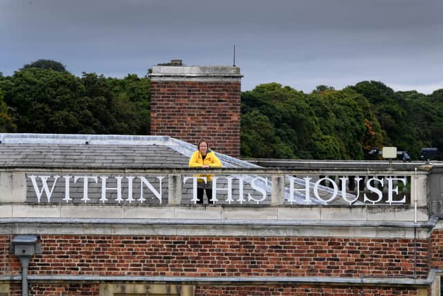 Head of House Keeping Maya Harrison on top of Temple Newsam House, Leeds, where the lettering has been repainted. Picture by Simon Hulme