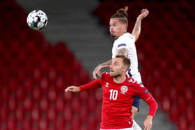Denmark's Christian Eriksen (bottom) and England's Kalvin Phillips battle for the ball.