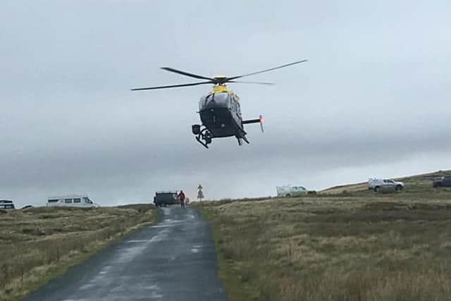 The police helicopter lands on a remote road