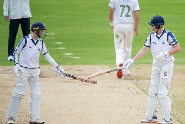 Yorkshire's Jonathan Tattersall congratulates Harry Brook on his half century against Leicestershire.