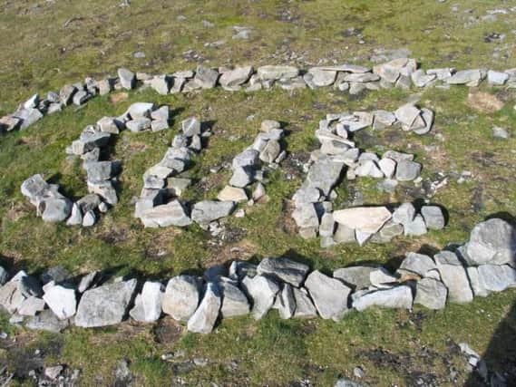 The National Park Authority want to discourage Three Peaks walkers from using ancient stones to spell out their names (photo: YDNPA)