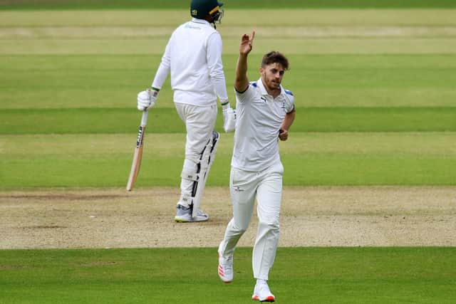 Yorkshire's Ben Coad celebrates taking the wicket of Leicestershire's Rishi Patel.  Picture: Jonathan Gawthorpe