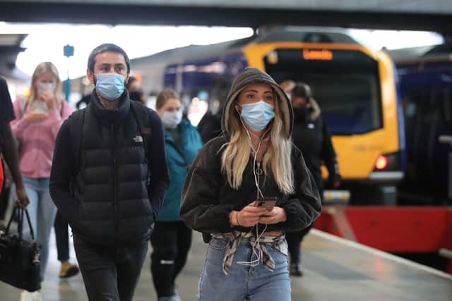Commuters travelling in masks