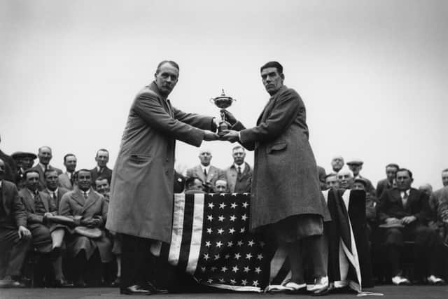 April 1929:  In Leeds, British golfer George Duncan (1883 - 1964) captain of the British Ryder Cup team is presented with the cup by British businessman Samuel Ryder (1859-1936), founder of the Ryder Golf Cup.  (Photo by Central Press/Getty Images)