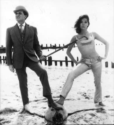 Patrick Macnee, as John Steed, and Diana Rigg as Emma Peel, in the sixties hit series The Avengers.