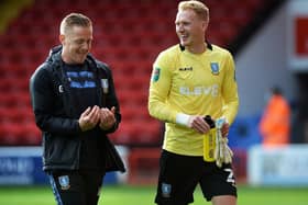 Owls keeper Cameron Dawson with manager Garry Monk. Pictures: Steve Ellis