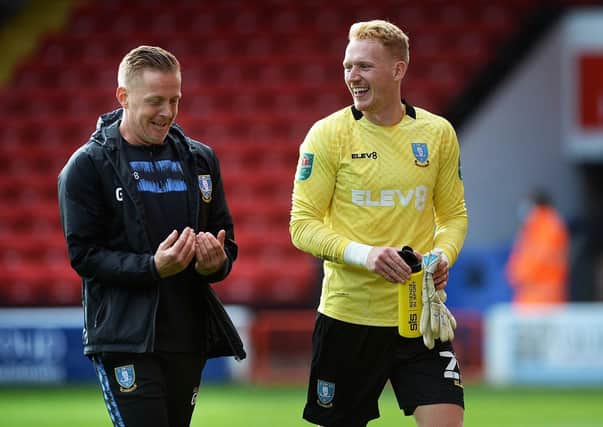 Owls keeper Cameron Dawson with manager Garry Monk. Pictures: Steve Ellis