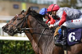 Rowan Scott riding Ubettabelieveit (near side) win The Bombardier Flying Childers Stakes during day three of the  St Leger Festival at Doncaster Racecourse.