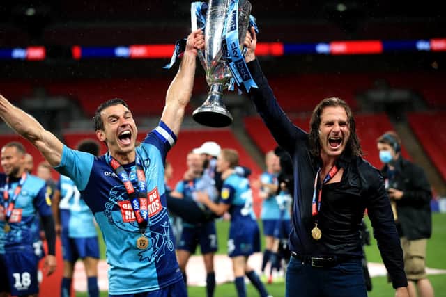 Wycombe Wanderers' Matt Bloomfield (left) and manager Gareth Ainsworth celebrate promotion via the League One play-off final. Picture: Adam Davy/PA
