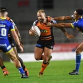FRUSTRATING TIMES: Castleford Tigers' Paul McShane battles with Warrington's Luis Johnson. Picture: Jonathan Gawthorpe