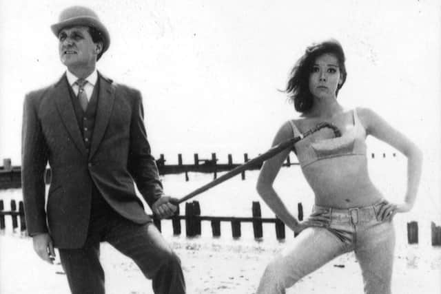 File photo dated 27/09/65 of actor Patrick Macnee, as John Steed, and Diana Rigg as Emma Peel, in the sixties hit series The Avengers.