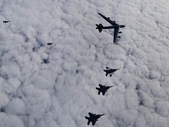 U.S. Air Force B-52H Stratofortress leading a formation of U.S. F-15C Eagles, F-15E Strike Eagles and Royal Netherlands Air Force F-16's over the North Sea