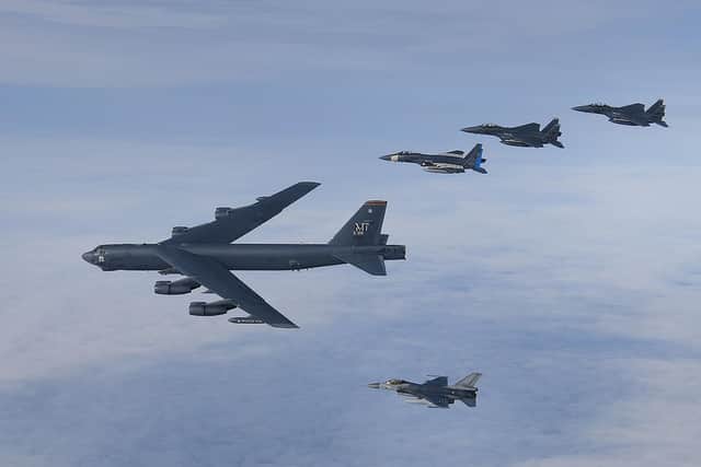 U.S. Air Force B-52H Stratofortress leading a formation of U.S. F-15C Eagles, F-15E Strike Eagles and Royal Netherlands Air Force F-16's over the North Sea