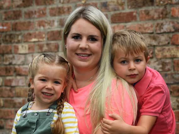 Jess Cooper, with children Archie, seven, and Emilia, three Picture: Jonathan Gawthorpe