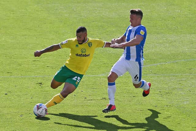 Norwich City's Onel Hernandez on the attack against Huddersfield's Jonathan Hogg (PA)