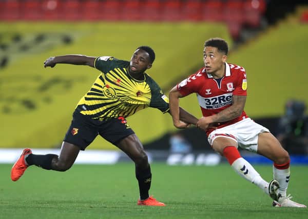 Watford's Jeremy Ngakia (left) and Middlesbrough's Marcus Tavernier battle for the ball.