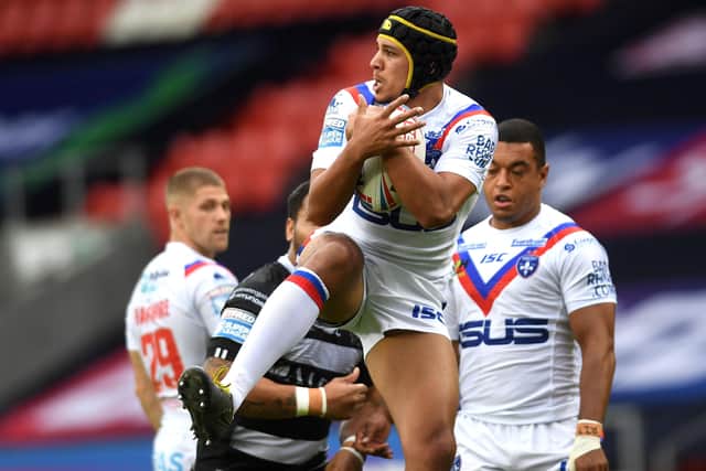 Wakefield's Ben Jones-Bishop takes a high ball against Hull FC.
