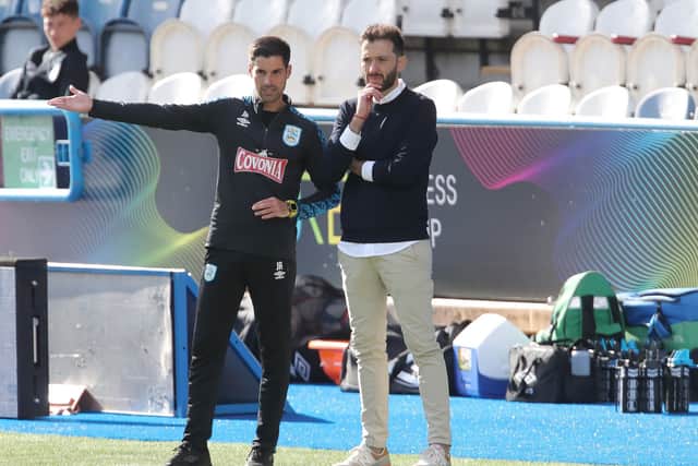 Huddersfield Town manager Carlos Corberan (right) and assistant coach Jorge Alarcon on the touchline(Picture: PA)