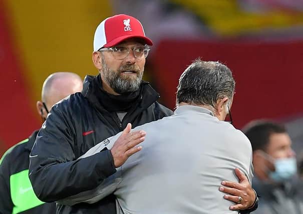 Liverpool manager Jurgen Klopp (left) and Leeds United manager Marcelo Bielsa embrace after the Premier League match at Anfield (Picture: PA)