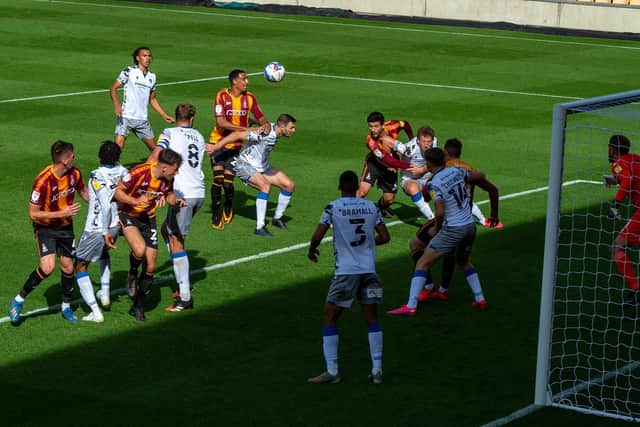 Kurtis Guthrie heads in at goal for Bradford City against Colchester United. (Picture: Bruce Rollinson)