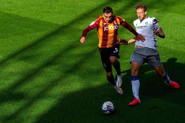 Lee Novak holds off Tom Eastman as Bradford City and Colchester United drew 0-0. (Picture: Bruce Rollinson)