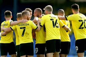 Harrogate Town's Aaron Martin (centre) celebrates scoring his side's third goal of the game with his teammates as Harrogate began life in the EFL with a thrashing of Southend United (Pictures: Steve Paston/PA)