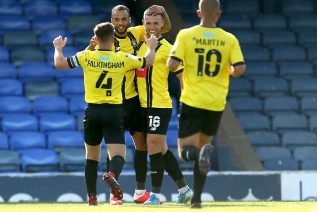 Harrogate Town's Jack Muldoon (centre) celebrates scoring his side's fourth goal at Southend (Picture: PA)