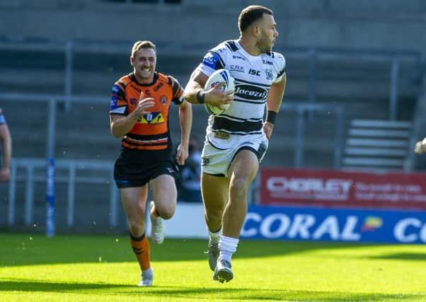 Sound investment: 
Hull's Carlos Tuimavave intercepts the ball and sprints away to score his second try of the match. Picture Tony Johnson