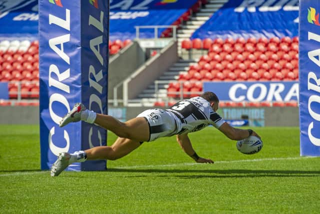 Done deal: Hull's Carlos Tuimavave scores the first try. Picture Tony Johnson