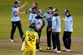 England's Jos Buttler (third left) and Adil Rashid (centre) celebrate with their team-mates after they combine to dismiss Australia's Alex Carey to win the second Royal London ODI match at Emirates Old Trafford.