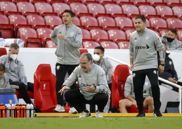 NOW HEAR THIS: Leeds United manager Marcelo Bielsa (centre) gestures to his players during the Premier League clash against defending champions Liverpool at Anfield. Picture: Phil Noble/NMC Pool/PA