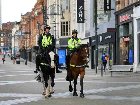 Demand on police is back to pre-Covid levels as forces battle to ensure the new 'rule of six' is adhered to. Officers pictured in Leeds city centre
