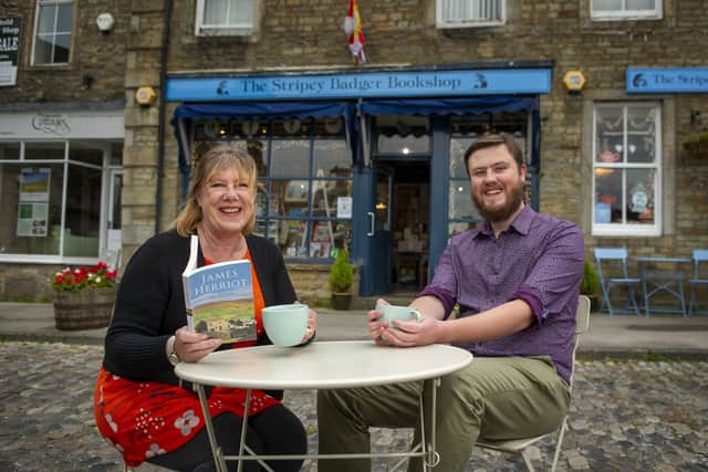 Mother and son owners Linda Furniss and James Firth at The Stripey Badger bookshop in Grassington, which is seeing an upturn in visitors after being used as part of the set for the new series of All Creatures Great and Small.  Picture Tony Johnson