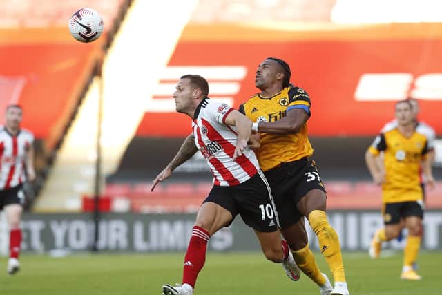 Sheffield United's Billy Sharp is challenged by Wolves' Adama Traore at Bramall Lane. Picture: Darren Staples/Sportimage