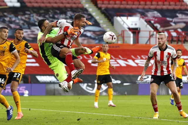 IN THE THICK OF IT: Sheffield United's Billy Sharp challenges Wolves' goalkeeper Rui Patricio of Wolverhampton Wanderers during the Premier League match at Bramall Lane. Picture: Darren Staples/Sportimage