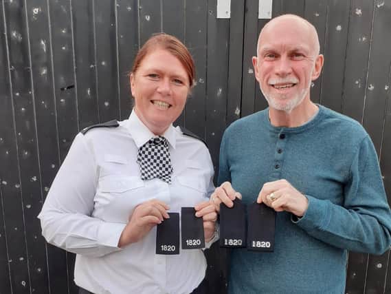 Pc Michelle Phillips with her father, retired officer Keith Bingham, and they collar number 1820 they share. Picture: South Yorkshire Police