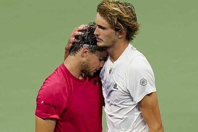 Dominic Thiem, of Austria, left, hugs Alexander Zverev, of Germany, after defeating Zverev in the men's singles final of the US Open tennis championship (AP Photo/Seth Wenig)