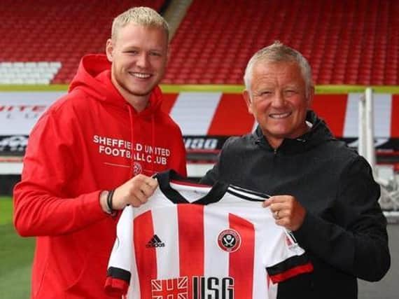 Goalkeeper Aaron Ramsdale signs for Sheffield United and is welcomed by manager Chris Wilder at Bramall Lane. Picture: Simon Bellis/Sportimage