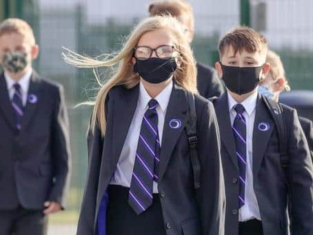 Pupils pictured wearing protective face masks at Outwood Academy Adwick in Doncaster, as schools reopened in England following the coronavirus lockdown. Photo credit: Danny Lawson/PA