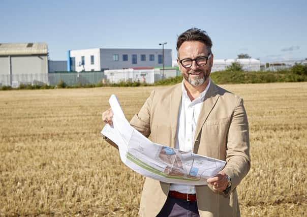 Integra Buildings Managing Director Gary Parker with plans for the expansion of the fast-growing modular construction company’s site in Paull, East Yorkshire. Picture: R&R Studio.