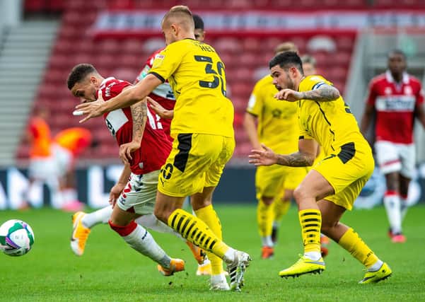 On guard: Boro's Marcus Browne is watched by Barnsley's Michal Helik.  Picture: Bruce Rollinson