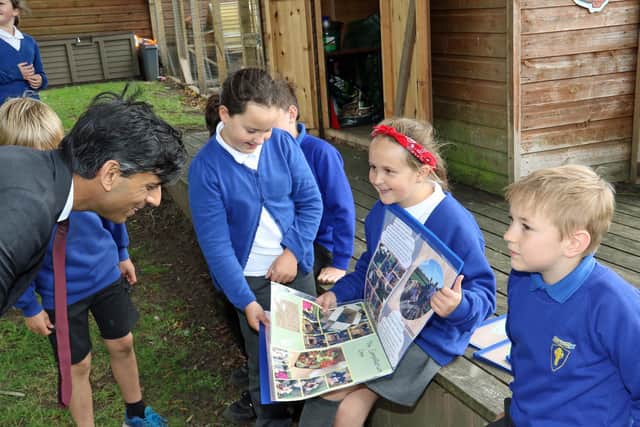 Chancellor of the Exchequer Rishi Sunak with pupils from the Pickhill Church of England Primary School eco team near Thirsk, North Yorkshire, while on a visit to his Richmond constituency. Photo: Ian Lamming/PA